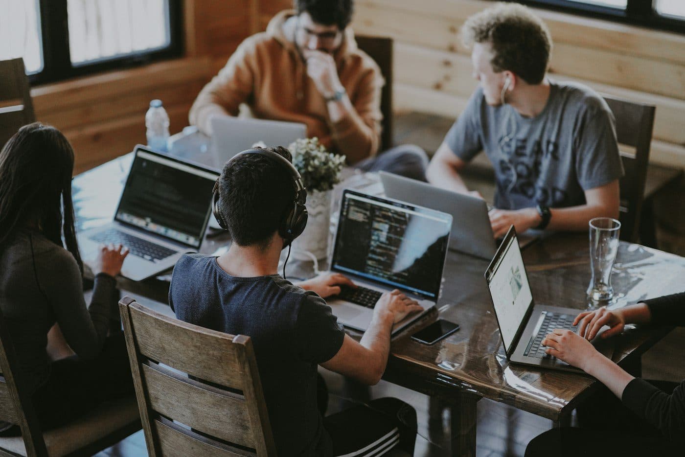 A team working together at their laptops